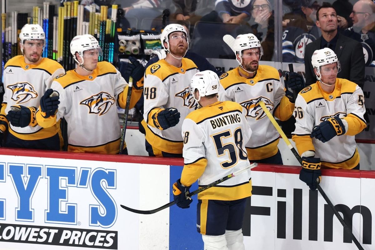 Oct 18, 2025; Winnipeg, Manitoba, CAN; Nashville Predators left wing Michael Bunting (58) celebrates his goal against the Winnipeg Jets during the third period at Canada Life Centre. Mandatory Credit: James Carey Lauder-Imagn Images