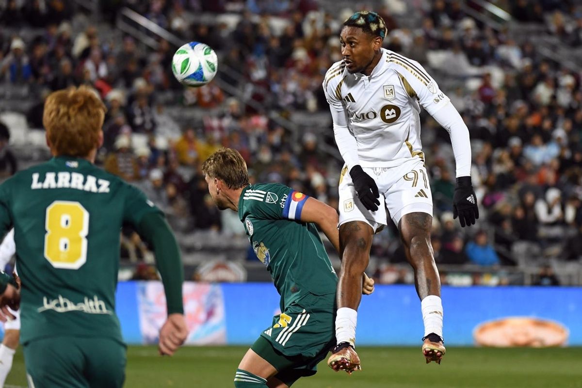 Oct 18, 2025; Commerce City, Colorado, USA; Los Angeles FC defender Nkosi Tafari (91) attempts to head the ball on a corner kick during the second half against Colorado Rapids at Dick's Sporting Goods Park. Mandatory Credit: Christopher Hanewinckel-Imagn Images