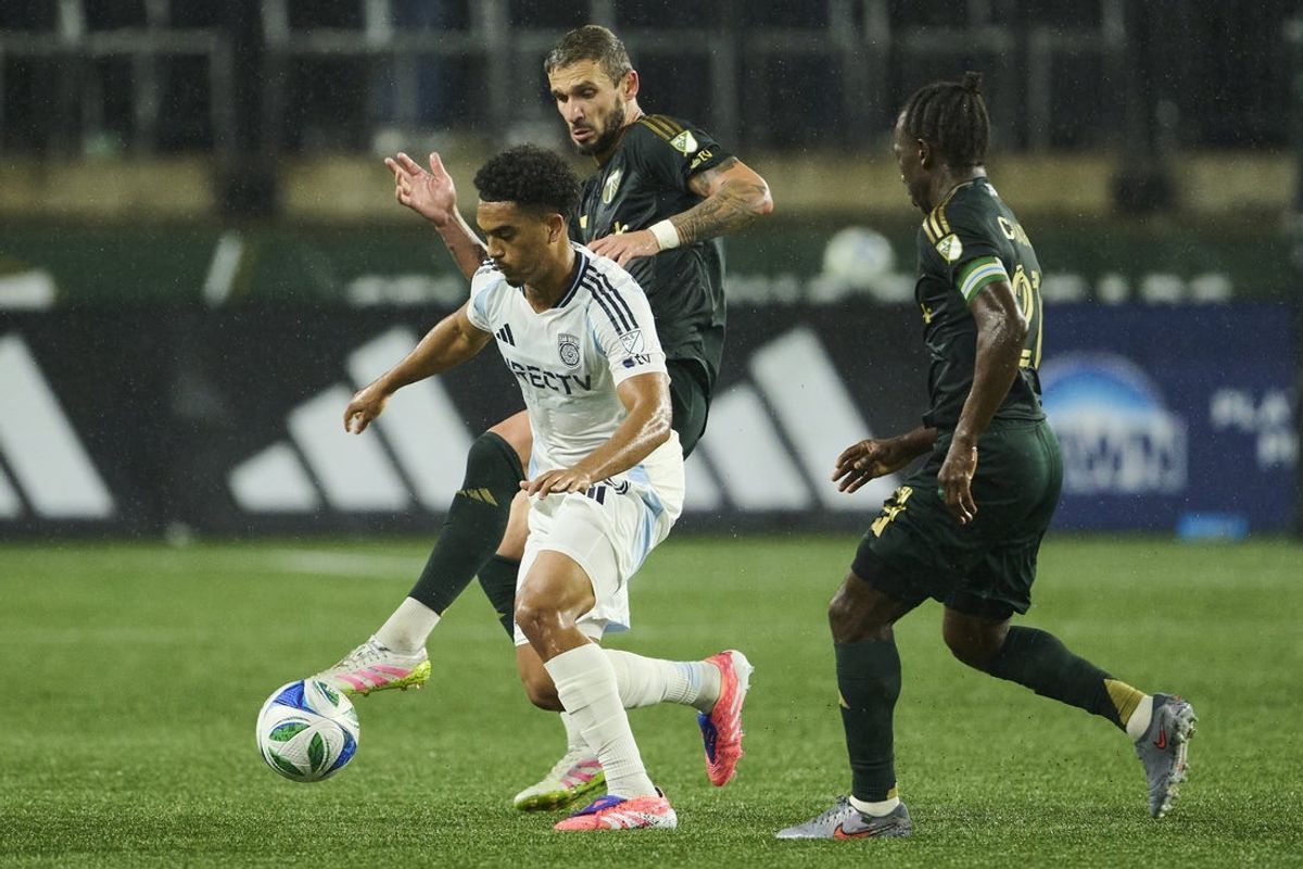 Oct 18, 2025; Portland, Oregon, USA; San Diego FC midfielder Pedro Soma (15) controls the ball during the second half against Portland Timbers defender Dario Zuparic (13) at Providence Park. Mandatory Credit: Troy Wayrynen-Imagn Images