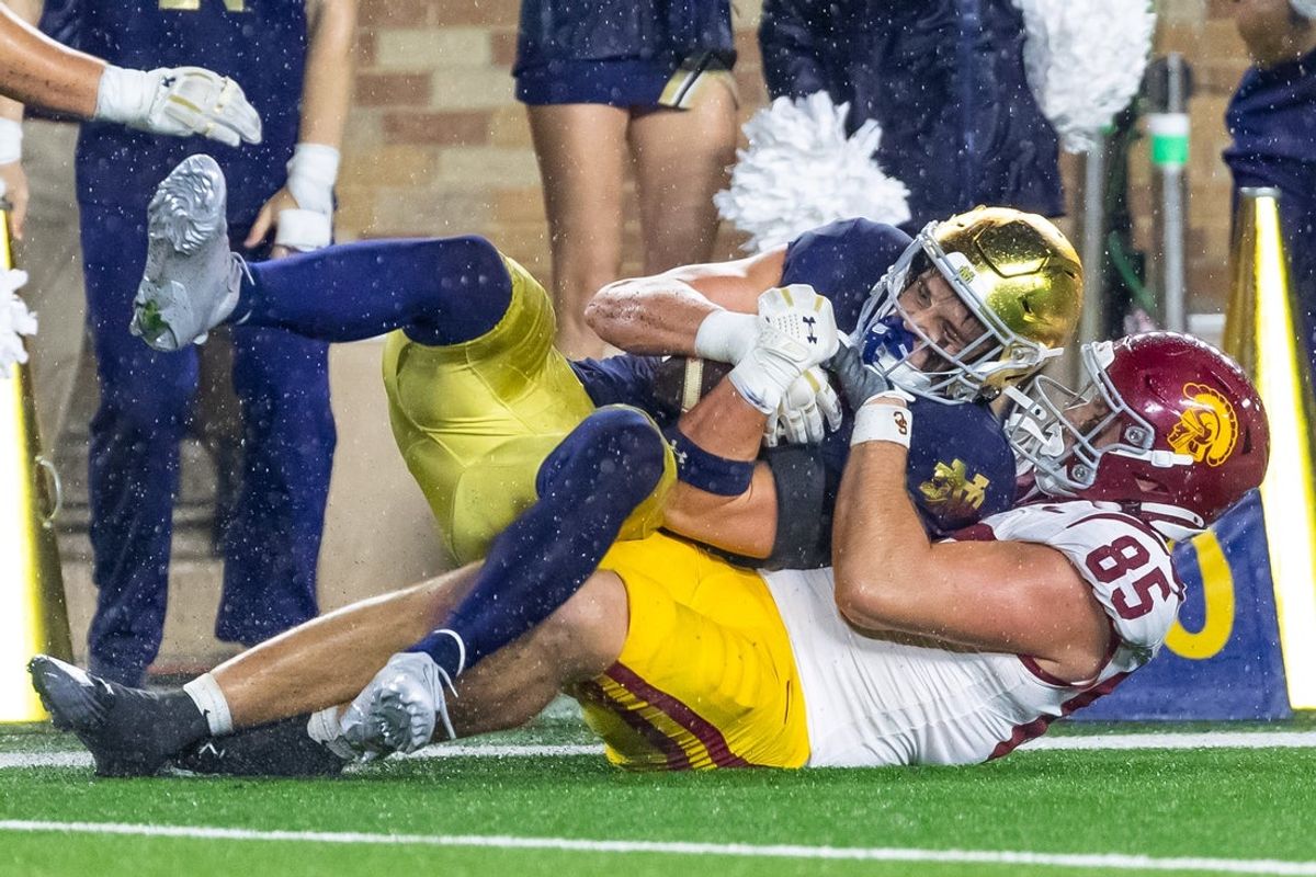 Oct 18, 2025; South Bend, Indiana, USA; Notre Dame Fighting Irish safety Luke Talich (28) intercepts a pass intended for Southern California Trojans tight end Walker Lyons (85) during the second half at Notre Dame Stadium. Mandatory Credit: Michael Caterina-Imagn Images