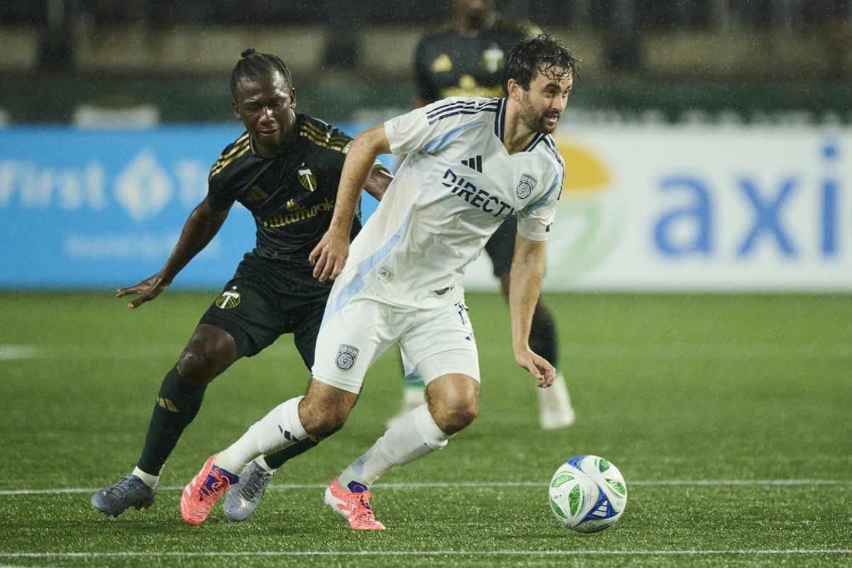 Oct 18, 2025; Portland, Oregon, USA; San Diego FC midfielder Luca de la Torre (14) controls the ball during the second half against Portland Timbers midfielder Diego Chara (21) at Providence Park. Mandatory Credit: Troy Wayrynen-Imagn Images