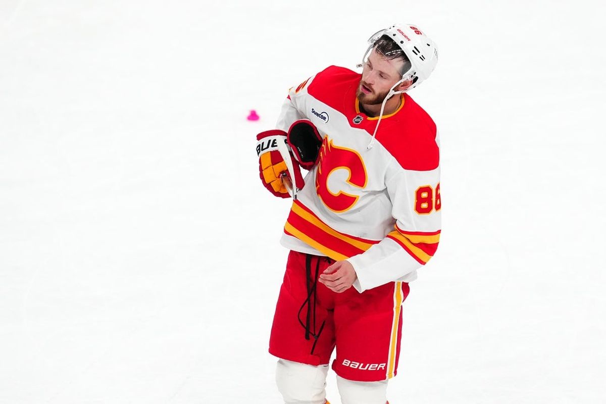 Oct 18, 2025; Las Vegas, Nevada, USA; Calgary Flames left wing Joel Farabee (86) skates off the ice after the Flames were defeated by the Vegas Golden Knights 6-1 at T-Mobile Arena. Mandatory Credit: Stephen R. Sylvanie-Imagn Images