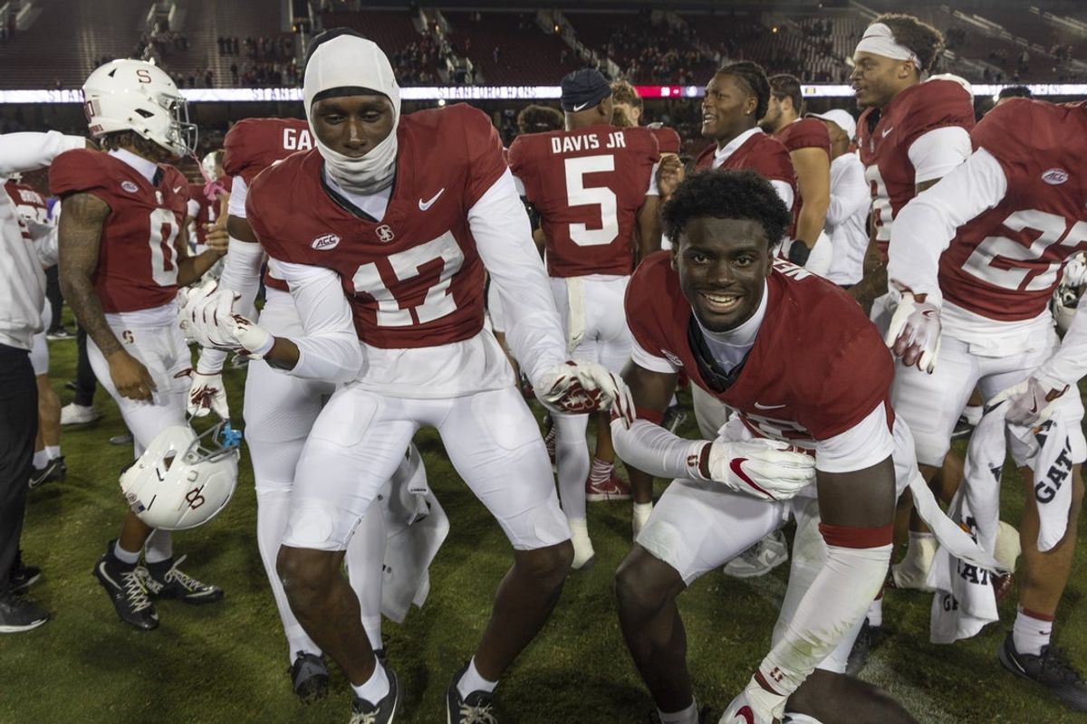 Oct 18, 2025; Stanford, California, USA;  Stanford Cardinal safety Omari Gaines (17) and defensive back Sam Neely III (28) celebrate after a victory over Florida State Seminoles at Stanford Stadium. Mandatory Credit: Stan Szeto-Imagn Images