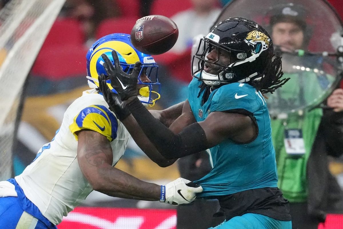 Oct 19, 2025; London, United Kingdom; Los Angeles Rams safety Kam Curl (3) breaks up a pass intended for Jacksonville Jaguars wide receiver Brian Thomas Jr. (7) during the second half of an NFL International Series game at Wembley Stadium. Mandatory Credit: Kirby Lee-Imagn Images