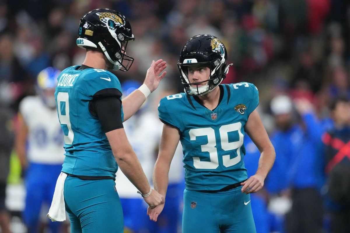 Oct 19, 2025; London, United Kingdom; Jacksonville Jaguars kicker Cam Little (39) is congratulated by punter Logan Cooke (9) after kicking a point after attempt against the Los Angeles Rams during the second half of an NFL International Series game at Wembley Stadium. Mandatory Credit: Kirby Lee-Imagn Images