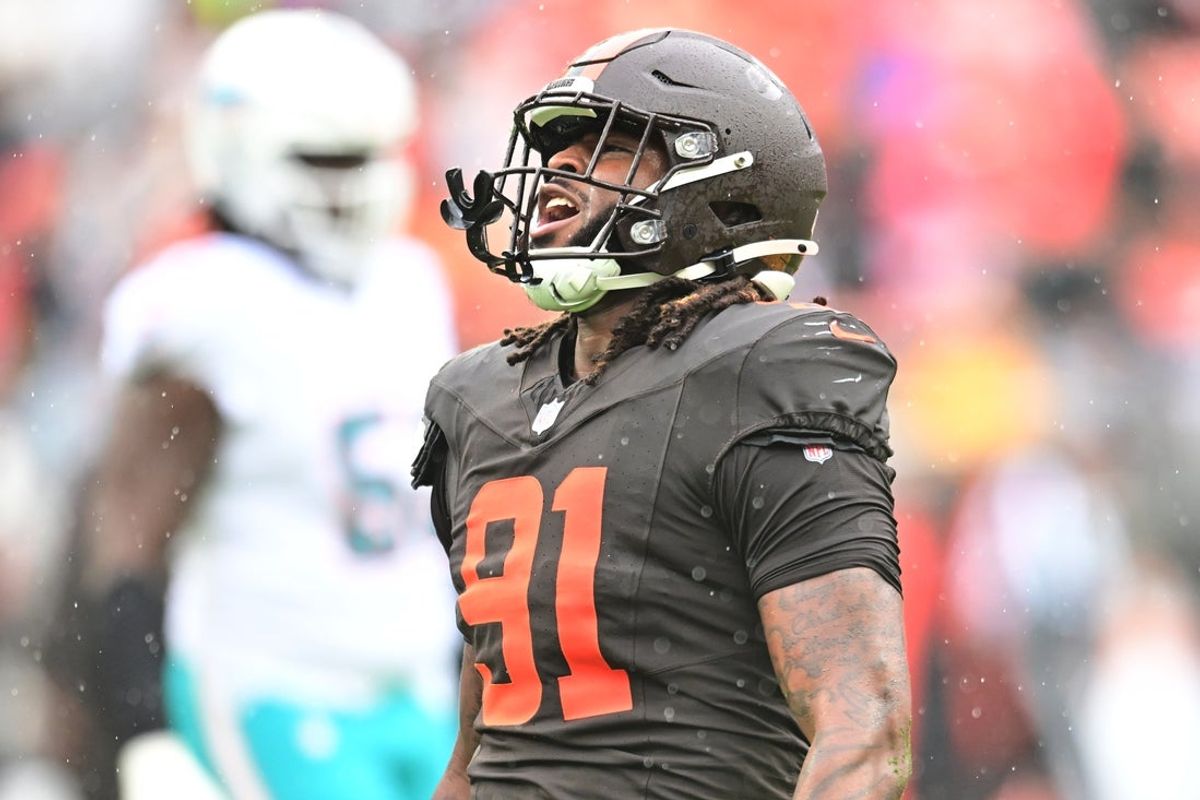 Oct 19, 2025; Cleveland, Ohio, USA; Cleveland Browns defensive end Alex Wright (91) celebrates after a play against the Miami Dolphins during the first quarter at Huntington Bank Field. Mandatory Credit: Ken Blaze-Imagn Images