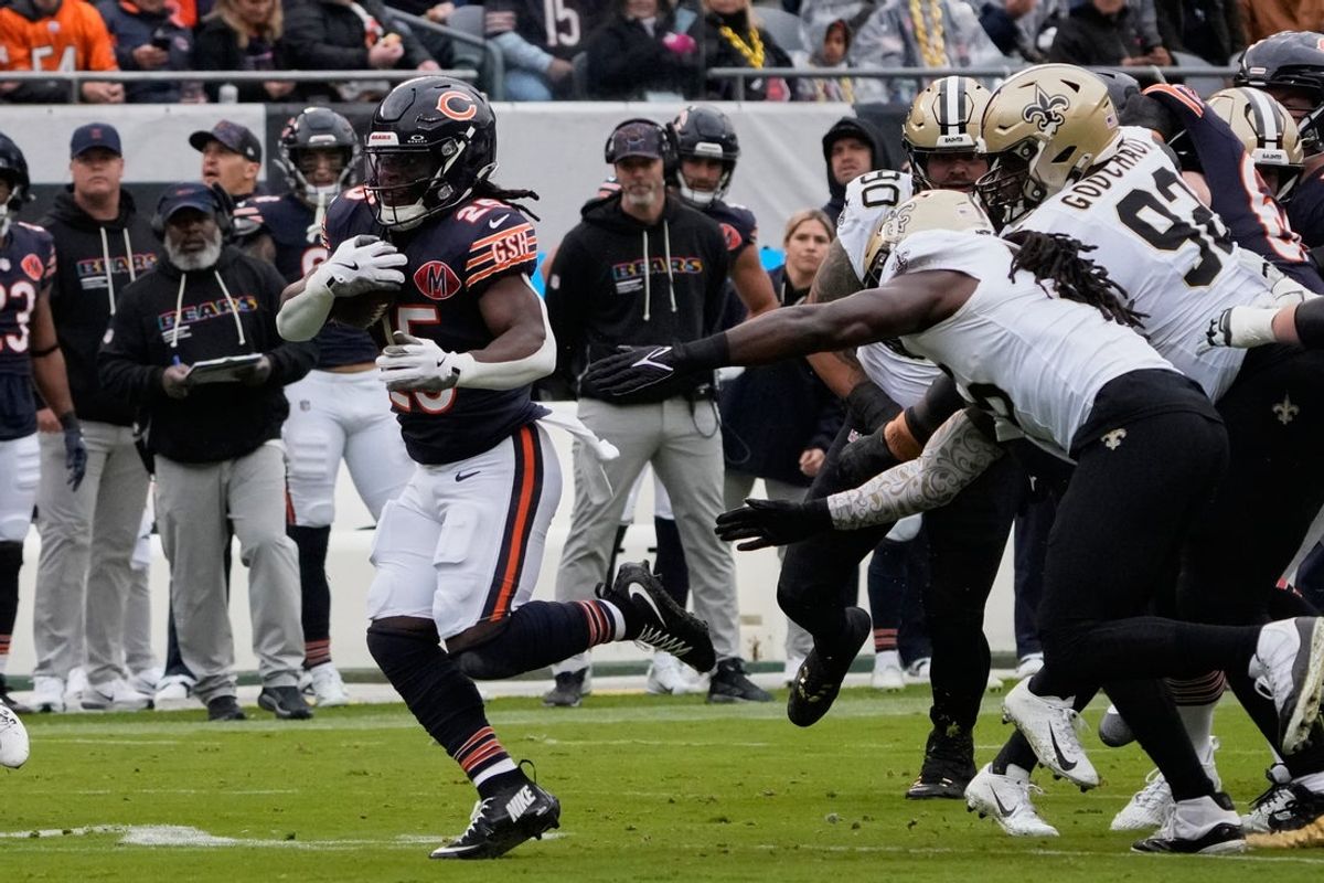 Oct 19, 2025; Chicago, Illinois, USA; Chicago Bears running back Kyle Monangai (25) runs the ball against the New Orleans Saints during the first half at Soldier Field. Mandatory Credit: David Banks-Imagn Images