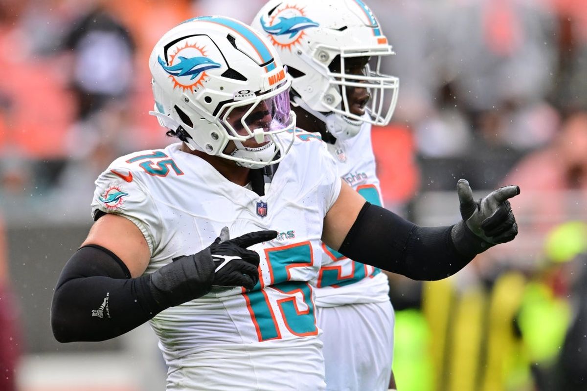 Oct 19, 2025; Cleveland, Ohio, USA; Miami Dolphins linebacker Jaelan Phillips (15) celebrates after a tackle during the first half against the Cleveland Browns at Huntington Bank Field. Mandatory Credit: Ken Blaze-Imagn Images