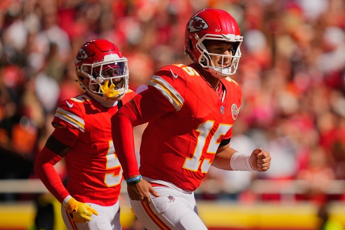 Oct 19, 2025; Kansas City, Missouri, USA; Kansas City Chiefs quarterback Patrick Mahomes (15) and wide receiver Marquise Brown (5) head to the bench after scoring a touchdown against the Las Vegas Raiders during the second quarter of the game at GEHA Field at Arrowhead Stadium. Mandatory Credit: Jay Biggerstaff-Imagn Images