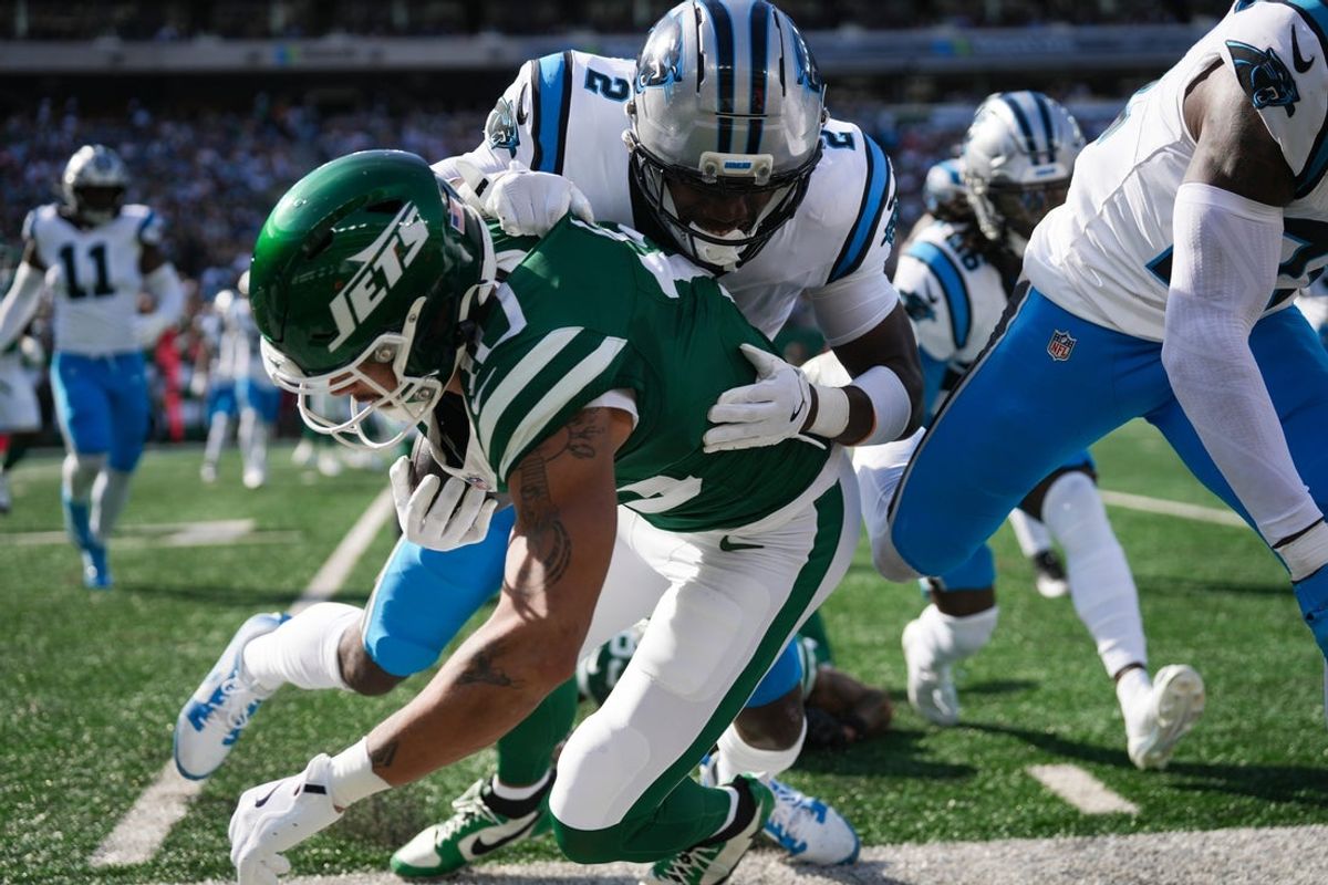 Carolina Panthers cornerback Mike Jackson (2) tackles New York Jets wide receiver Allen Lazard (10) during a game at MetLife Stadium, Oct 19, 2025, East Rutherford, NJ, USA.