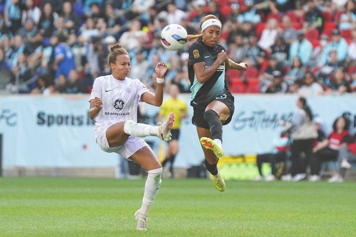 Oct 19, 2025; Harrison, New Jersey, USA; Racing Louisville FC defender Ellie Jean (5) and Gotham FC forward Margaret Purce (23) fight for a ball during the first half at Sports Illustrated Stadium. Mandatory Credit: Lucas Boland-Imagn Images