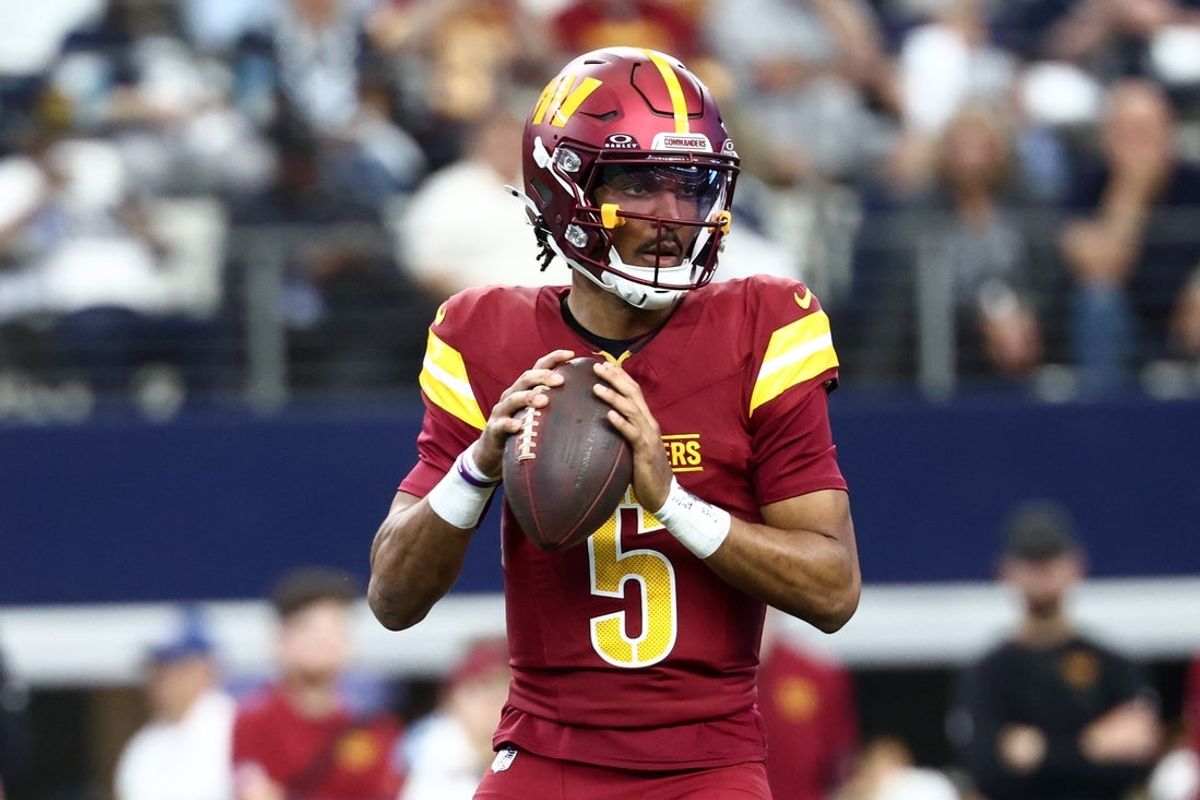 Oct 19, 2025; Arlington, Texas, USA; Washington Commanders quarterback Jayden Daniels (5) looks to pass the ball against the Dallas Cowboys during the first quarter of the game at AT&T Stadium. Mandatory Credit: Kevin Jairaj-Imagn Images