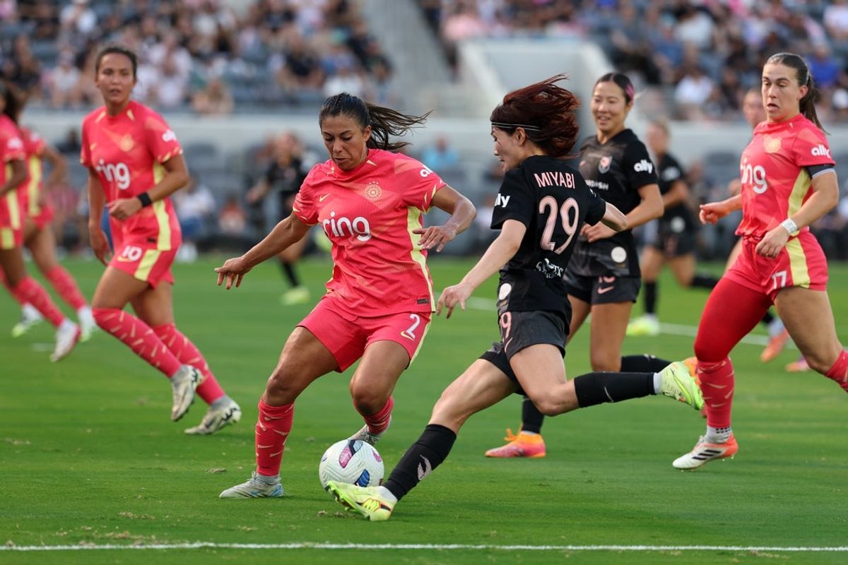 Oct 19, 2025; Los Angeles, California, USA;  Portland Thorns FC defender Reyna Reyes (2) defends Angel City FC defender Miyabi Moriya (29) during the first half at BMO Stadium. Mandatory Credit: Kiyoshi Mio-Imagn Images