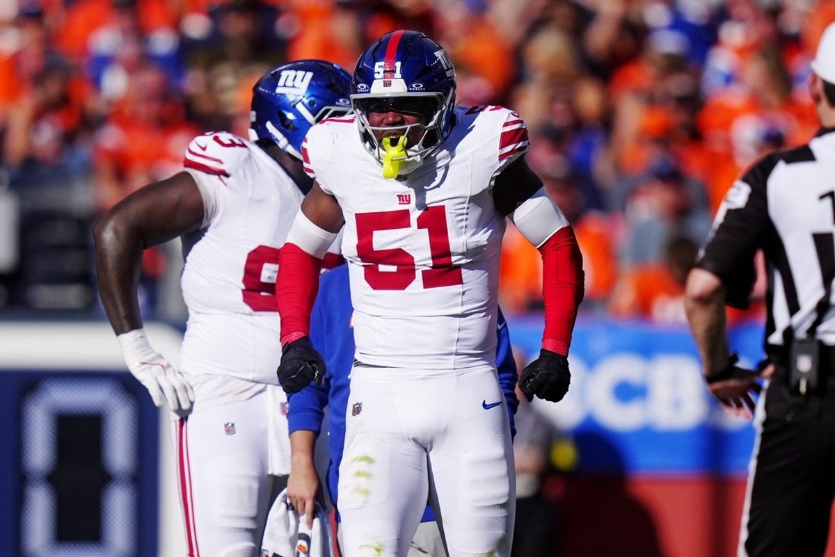 Oct 19, 2025; Denver, Colorado, USA; New York Giants linebacker Abdul Carter (51) reacts after a play against the Denver Broncos during the second half at Empower Field at Mile High. Mandatory Credit: Ron Chenoy-Imagn Images