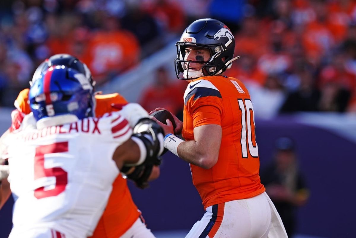 Oct 19, 2025; Denver, Colorado, USA; Denver Broncos quarterback Bo Nix (10) drops back for a pass during the second half against the New York Giants at Empower Field at Mile High. Mandatory Credit: Ron Chenoy-Imagn Images