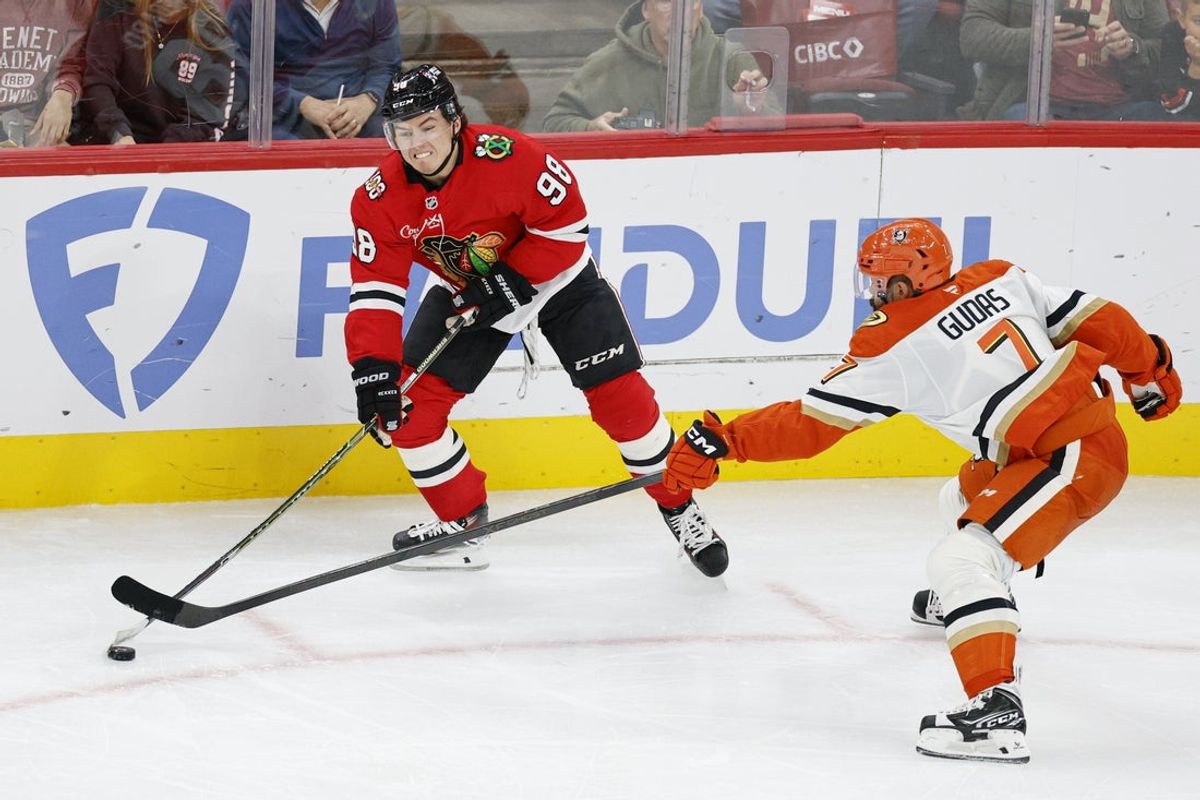 Oct 19, 2025; Chicago, Illinois, USA; Anaheim Ducks defenseman Radko Gudas (7) defends against Chicago Blackhawks center Connor Bedard (98) during the second period at United Center. Mandatory Credit: Kamil Krzaczynski-Imagn Images