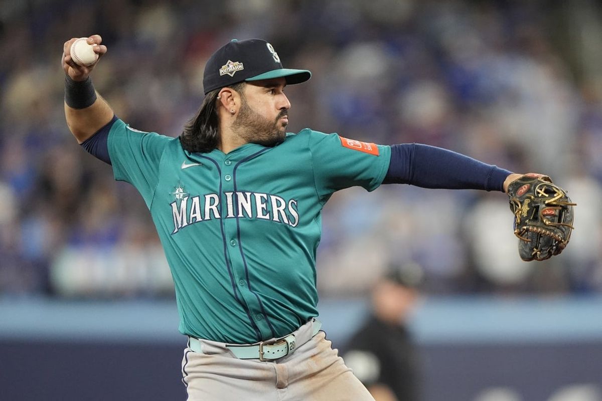 Oct 19, 2025; Toronto, Ontario, CAN; Seattle Mariners third baseman Eugenio Suarez (28) throws to first for an out against Toronto Blue Jays right fielder George Springer (not pictured) in the sixth inning during game six of the ALCS round for the 2025 MLB playoffs at Rogers Centre. Mandatory Credit: John E. Sokolowski-Imagn Images