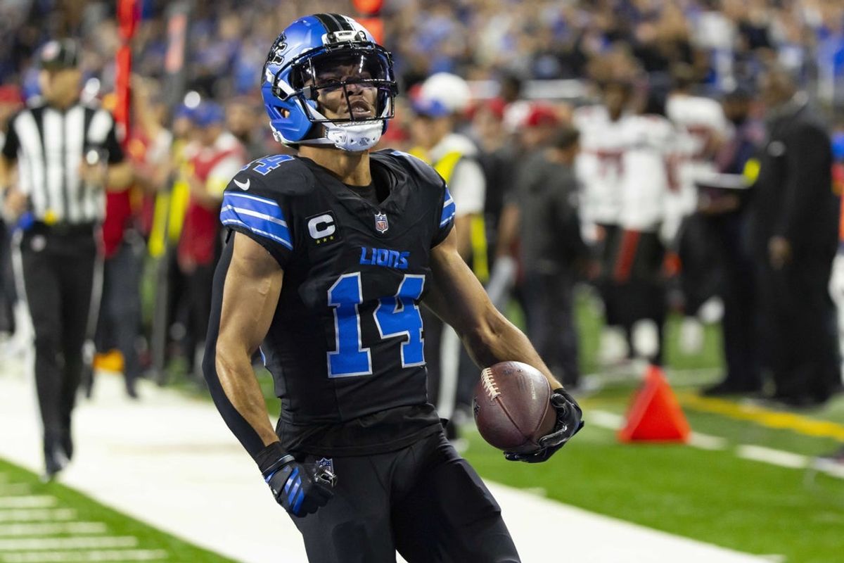 Oct 20, 2025; Detroit, Michigan, USA; Detroit Lions wide receiver Amon-Ra St. Brown (14) makes a touchdown catch against the Tampa Bay Buccaneers during the first half at Ford Field. Mandatory Credit: David Reginek-Imagn Images