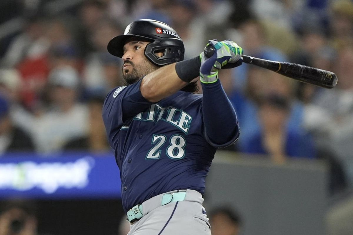 Oct 20, 2025; Toronto, Ontario, CAN; Seattle Mariners third baseman Eugenio Suarez (28) hits a single against the Toronto Blue Jays in the second inning during game seven of the ALCS round for the 2025 MLB playoffs at Rogers Centre.  Mandatory Credit: John E. Sokolowski-Imagn Images