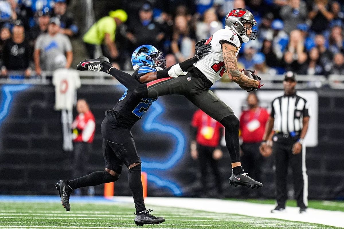 Tampa Bay Buccaneers wide receiver Mike Evans (13) tries to makes a catch against Detroit Lions cornerback Rock Ya-Sin (23) during the first half at Ford Field in Detroit on Monday, Oct. 20, 2025.