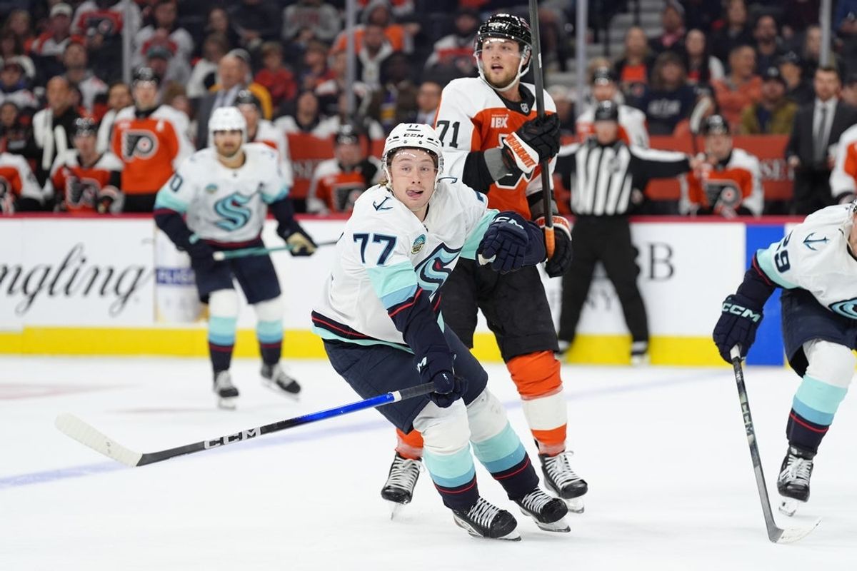 Oct 20, 2025; Philadelphia, Pennsylvania, USA; Seattle Kraken center Berkly Catton (77) skates against Philadelphia Flyers right wing Tyson Foerster (71) in the second period at Xfinity Mobile Arena. Mandatory Credit: Kyle Ross-Imagn Images