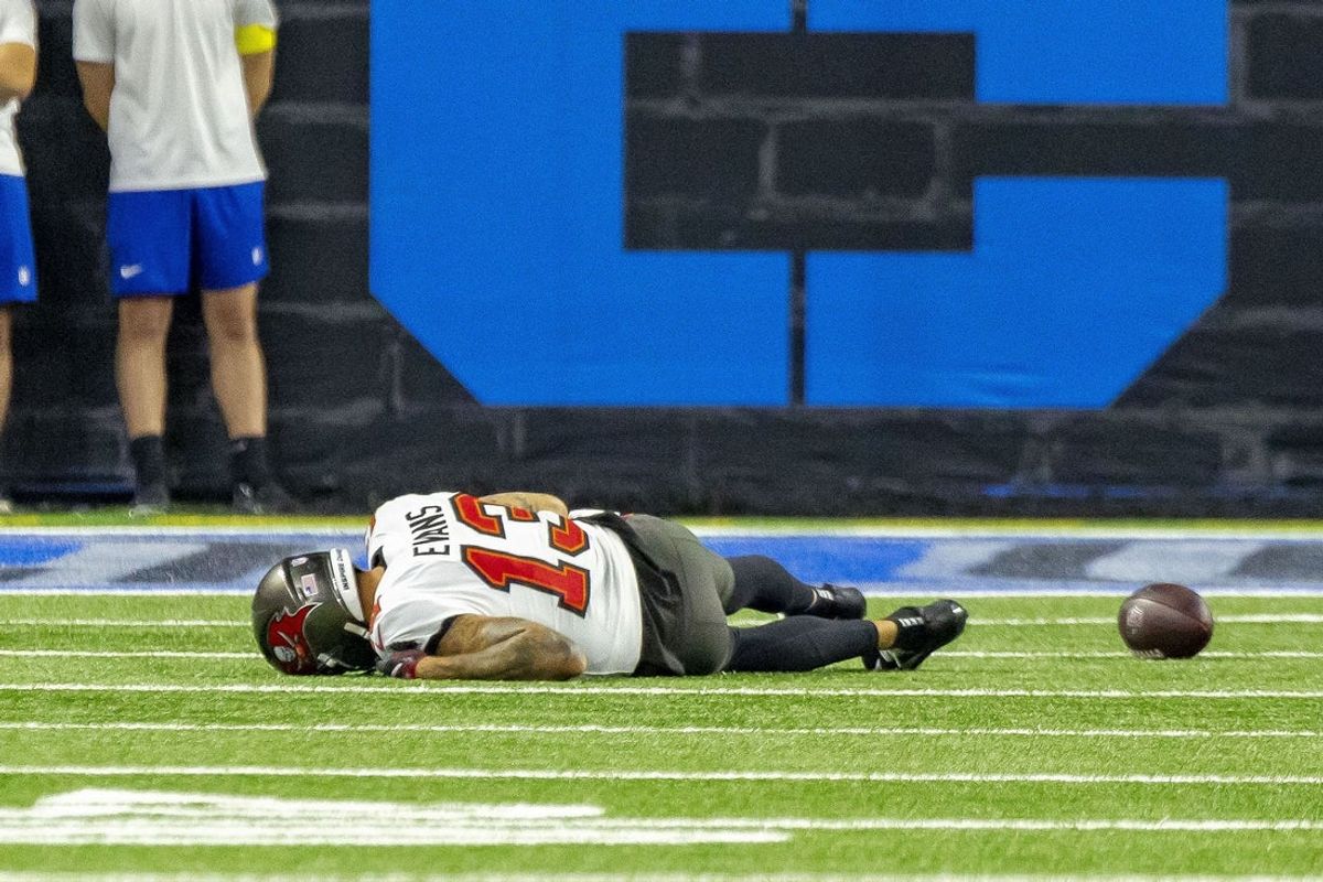 Oct 20, 2025; Detroit, Michigan, USA; Tampa Bay Buccaneers wide receiver Mike Evans (13) lays on the turf after an injury against the Detroit Lions during the first half at Ford Field. Mandatory Credit: David Reginek-Imagn Images