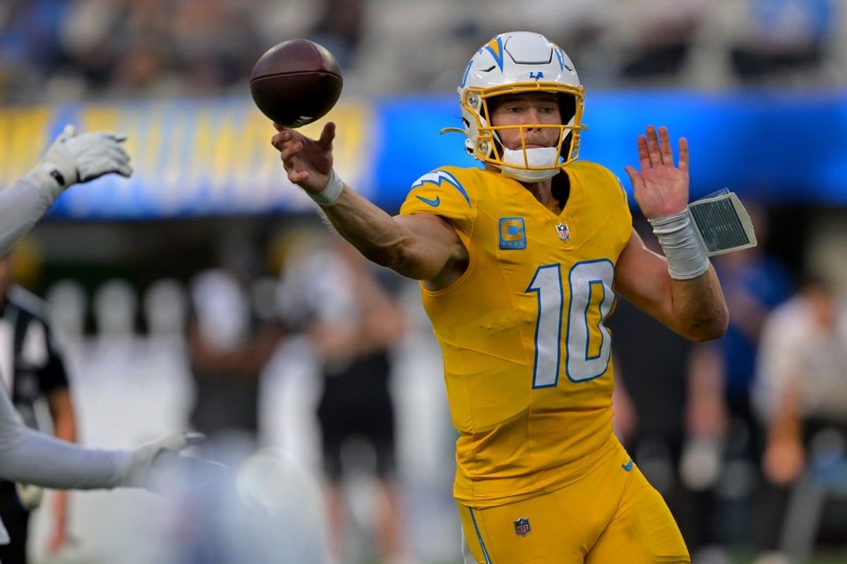 Oct 19, 2025; Inglewood, California, USA; Los Angeles Chargers quarterback Justin Herbert (10) throws a touchdown pass in the first half against the Indianapolis Colts at SoFi Stadium. Mandatory Credit: Jayne Kamin-Oncea-Imagn Images