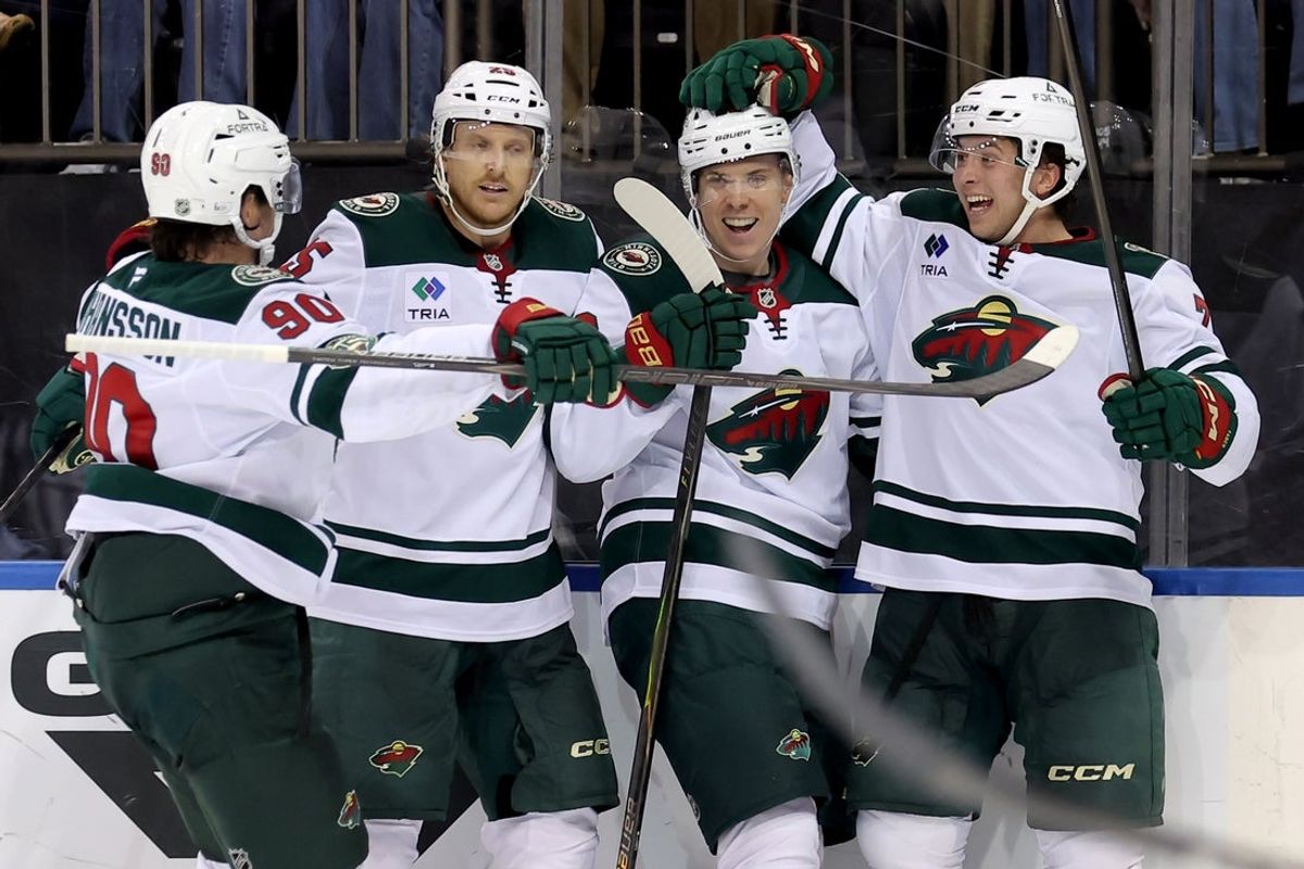 Oct 20, 2025; New York, New York, USA; Minnesota Wild right wing Danila Yurov (22) celebrates his goal against the New York Rangers with left wing Marcus Johansson (90) and defensem3n Jonas Brodin (25) and Brock Faber (7) during the third period at Madison Square Garden. Mandatory Credit: Brad Penner-Imagn Images