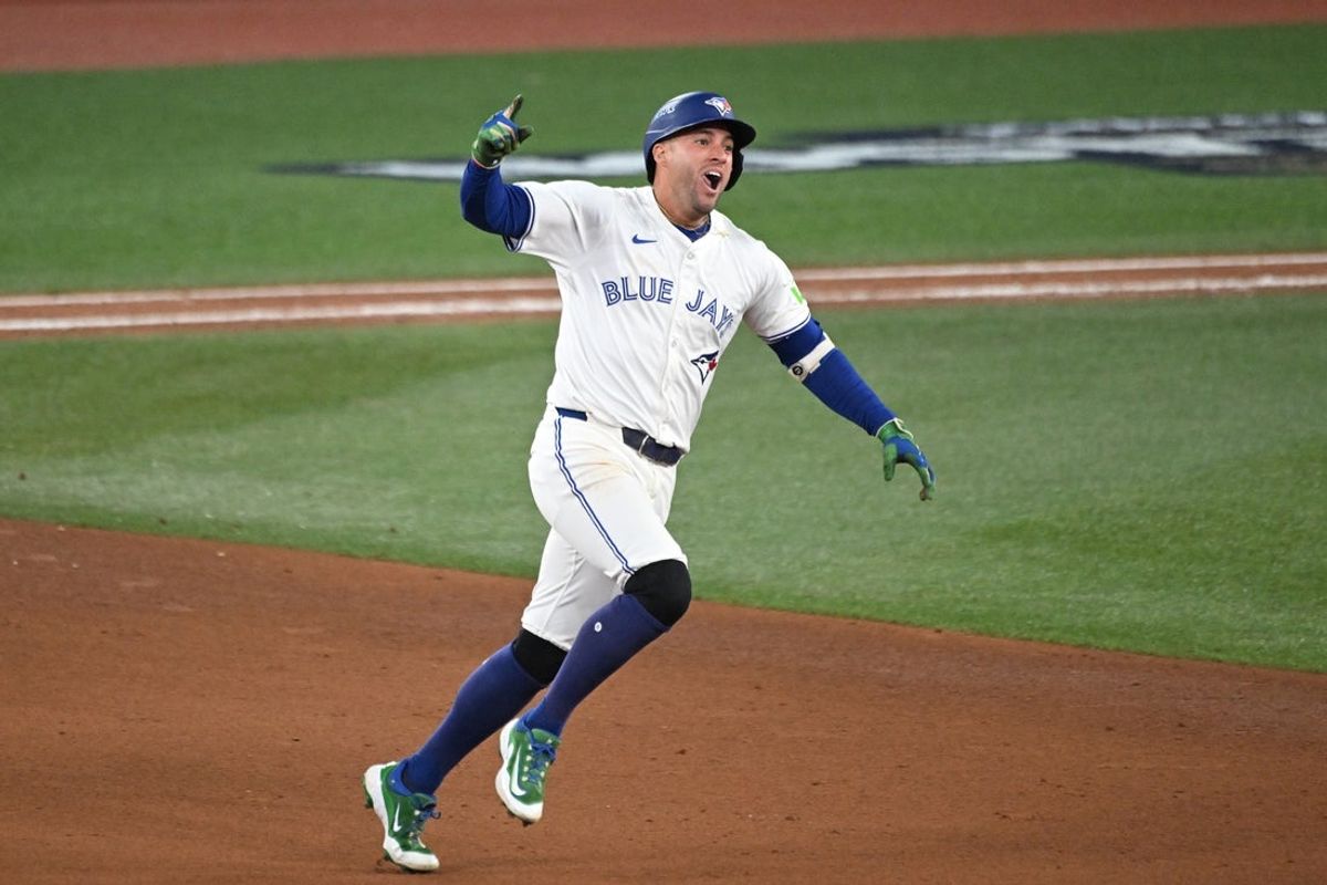 Oct 20, 2025; Toronto, Ontario, CAN; Toronto Blue Jays right fielder George Springer (4) celebrates as he runs the bases after hitting a three run home run against the Seattle Mariners in the seventh inning during game seven of the ALCS round for the 2025 MLB playoffs at Rogers Centre. Mandatory Credit: Dan Hamilton-Imagn Images