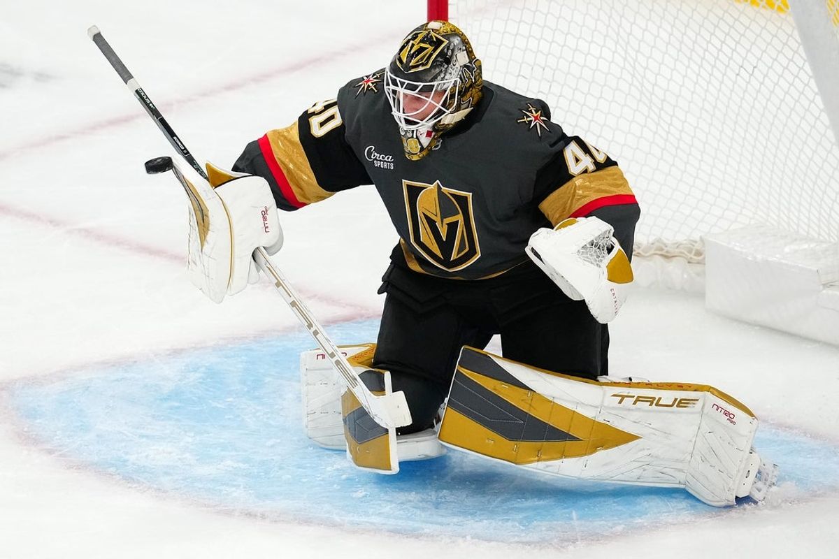 Oct 20, 2025; Las Vegas, Nevada, USA; Vegas Golden Knights goaltender Akira Schmid (40) makes a blocker save against the Carolina Hurricanes during the second period at T-Mobile Arena. Mandatory Credit: Stephen R. Sylvanie-Imagn Images