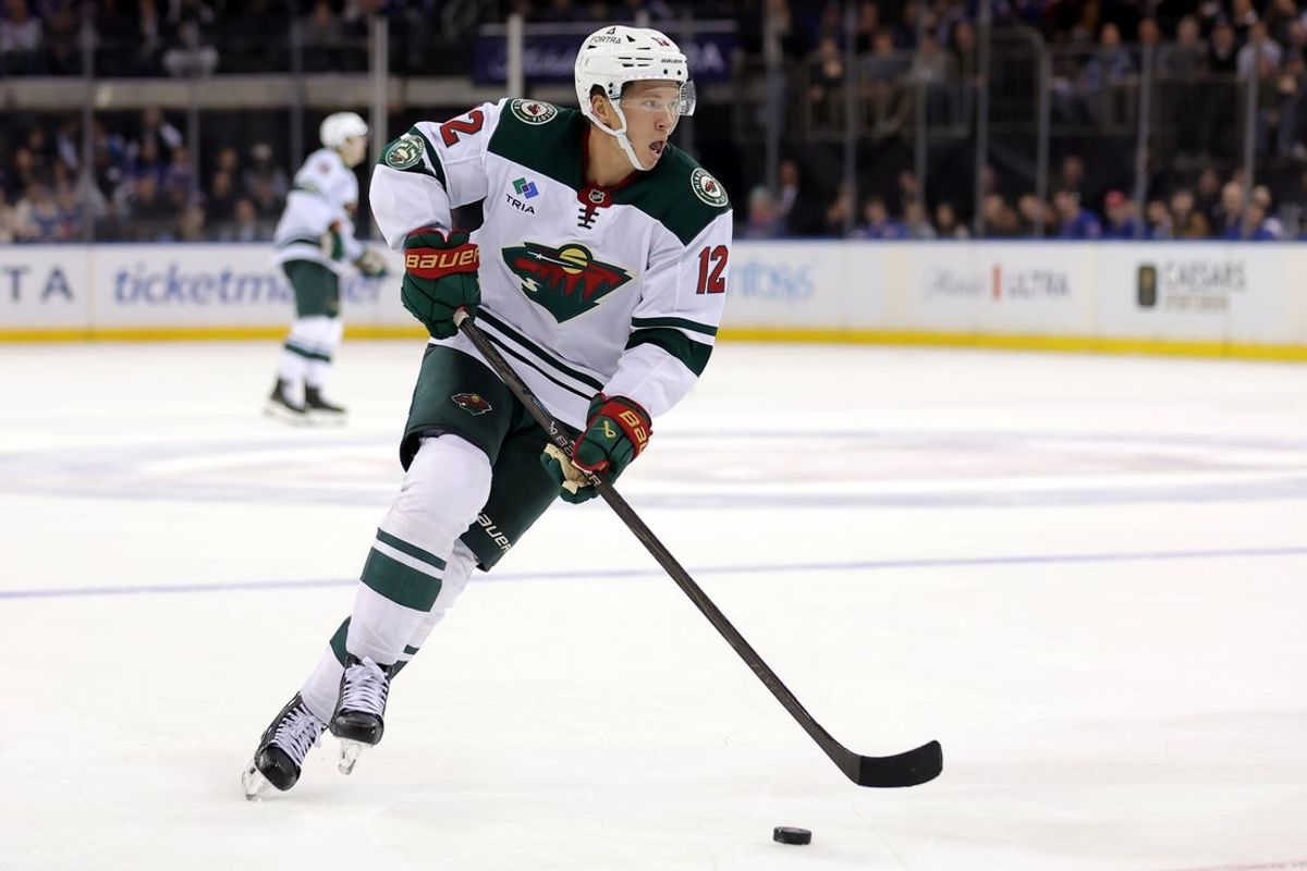 Oct 20, 2025; New York, New York, USA; Minnesota Wild left wing Matt Boldy (12) skates with the puck against the New York Rangers during the third period at Madison Square Garden. Mandatory Credit: Brad Penner-Imagn Images