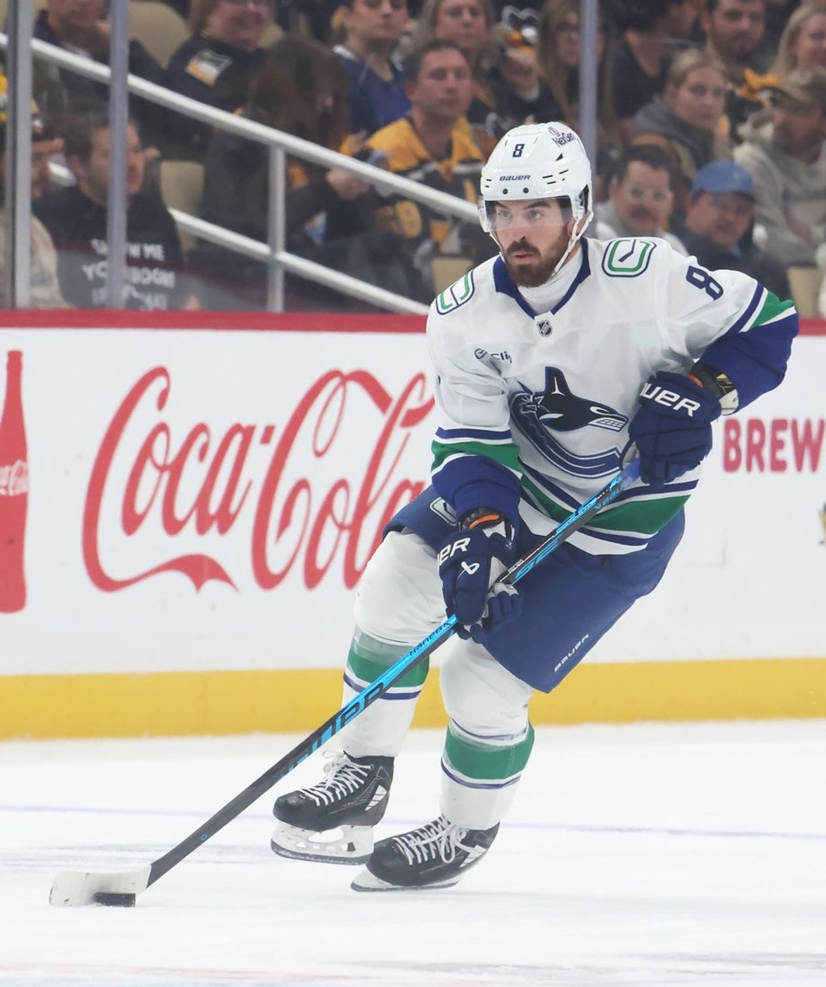 Oct 21, 2025; Pittsburgh, Pennsylvania, USA;  Vancouver Canucks right wing Conor Garland (8) skates with the puck against the Pittsburgh Penguins during the first period at PPG Paints Arena. Mandatory Credit: Charles LeClaire-Imagn Images