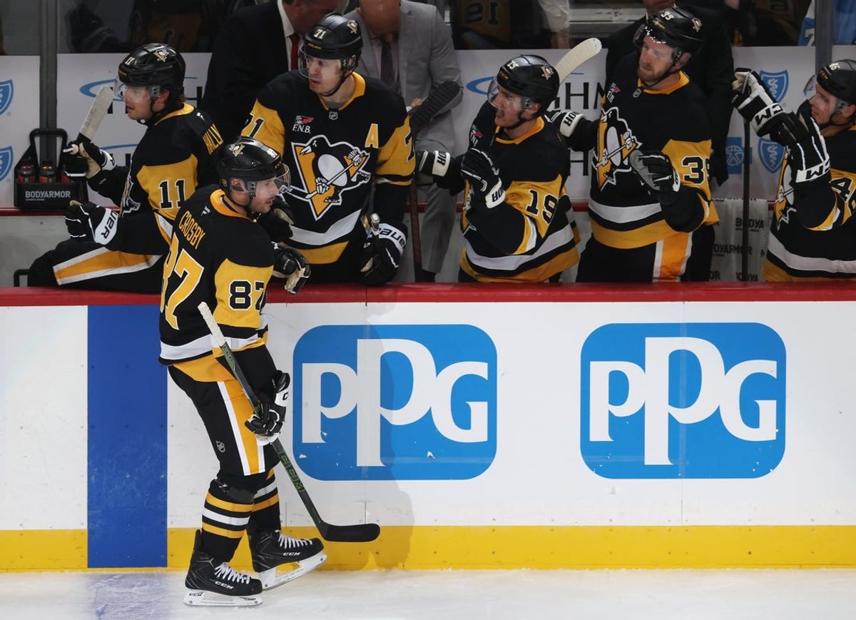 Oct 21, 2025; Pittsburgh, Pennsylvania, USA;  Pittsburgh Penguins center Sidney Crosby (87) celebrates with the Penguins bench after scoring a goal against the Vancouver Canucks during the second period at PPG Paints Arena. Mandatory Credit: Charles LeClaire-Imagn Images