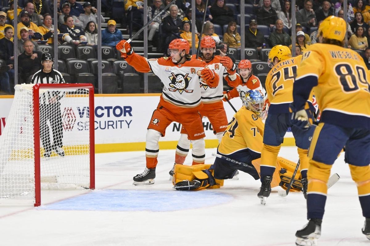 Oct 21, 2025; Nashville, Tennessee, USA;  Anaheim Ducks center Leo Carlsson (91) celebrates his goal against Nashville Predators goaltender Juuse Saros (74) during the second period at Bridgestone Arena. Mandatory Credit: Steve Roberts-Imagn Images