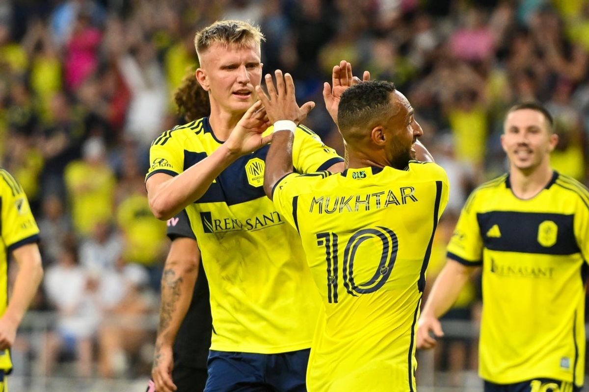 Oct 18, 2025; Nashville, Tennessee, USA;  Nashville SC midfielder Hany Mukhtar (10) celebrates the goal of forward Sam Surridge (9) against Inter Miami during the first half at Geodis Park. Mandatory Credit: Steve Roberts-Imagn Images