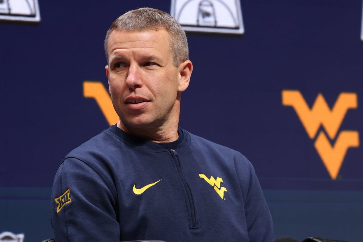 Oct 22, 2025; Kansas City, MO, USA; West Virginia head coach Ross Hodge speaks to media during Big 12 Menís Basketball media day at T-Mobile Center. Mandatory Credit: Sophia Scheller-Imagn Images