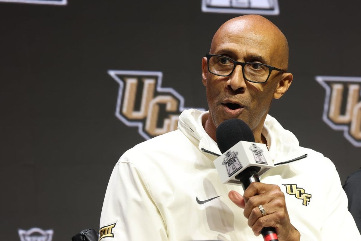 Oct 22, 2025; Kansas City, MO, USA; UCF head coach Johnny Dawkins speaks to media during Big 12 Menís Basketball media day at T-Mobile Center. Mandatory Credit: Sophia Scheller-Imagn Images