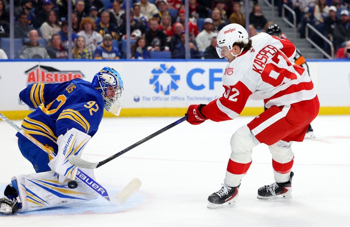 Oct 22, 2025; Buffalo, New York, USA;  Buffalo Sabres goaltender Colten Ellis (92) makes a save on Detroit Red Wings center Marco Kasper (92) during the first period at KeyBank Center. Mandatory Credit: Timothy T. Ludwig-Imagn Images