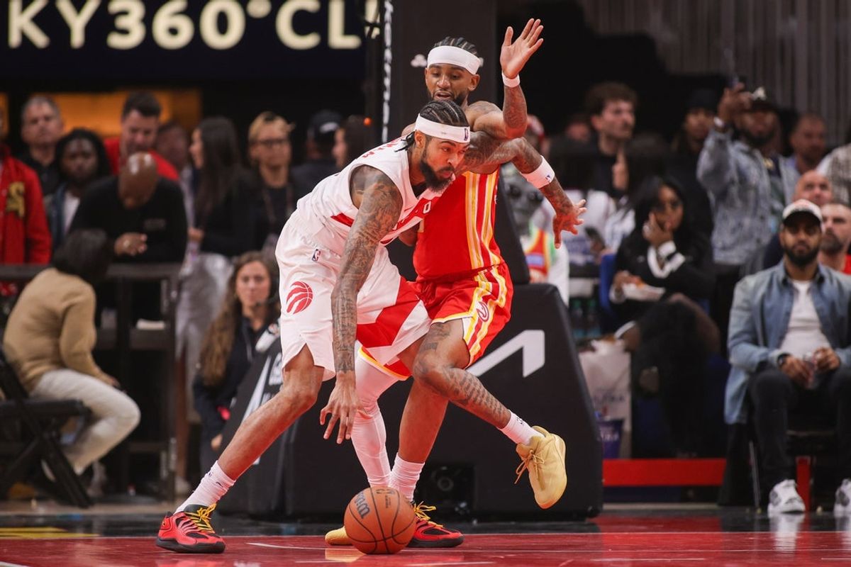 Oct 22, 2025; Atlanta, Georgia, USA; Toronto Raptors forward RJ Barrett (9) is defended by Atlanta Hawks guard Nickeil Alexander-Walker (7) in the second quarter at State Farm Arena. Mandatory Credit: Brett Davis-Imagn Images