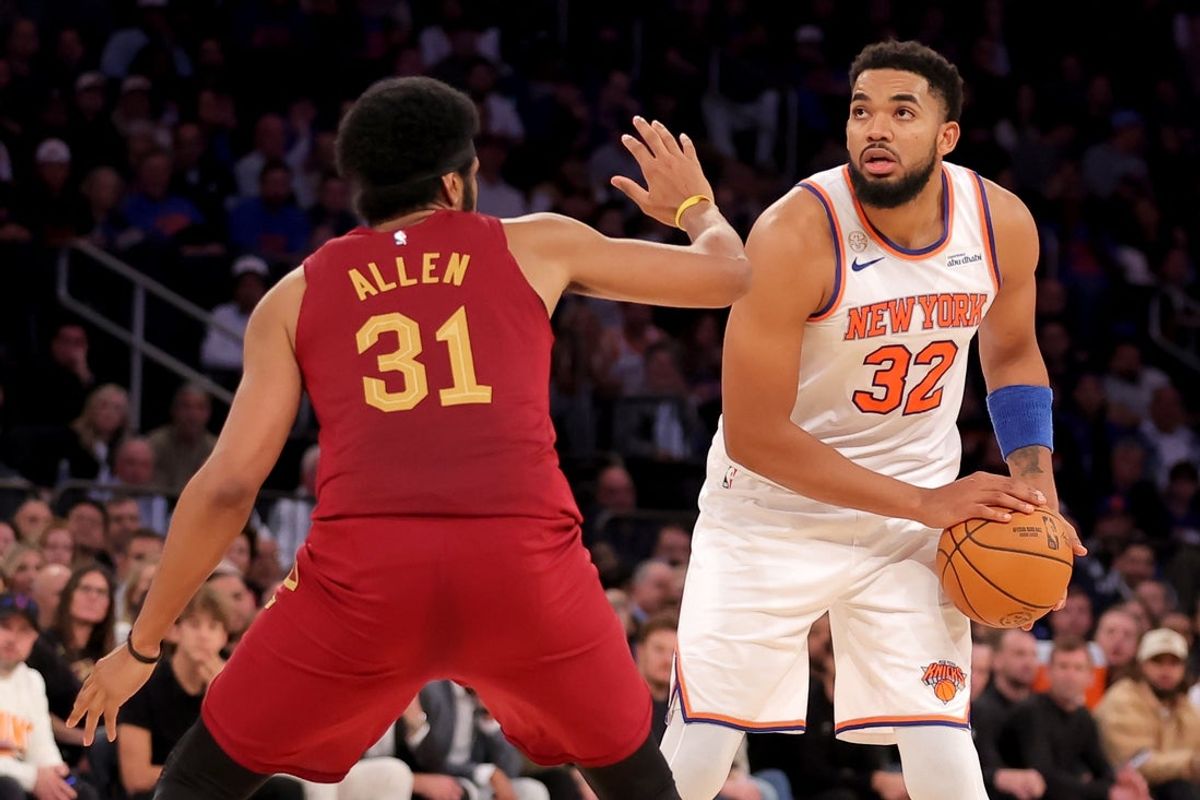 Oct 22, 2025; New York, New York, USA; New York Knicks center Karl-Anthony Towns (32) controls the ball against Cleveland Cavaliers center Jarrett Allen (31) during the fourth quarter at Madison Square Garden. Mandatory Credit: Brad Penner-Imagn Images