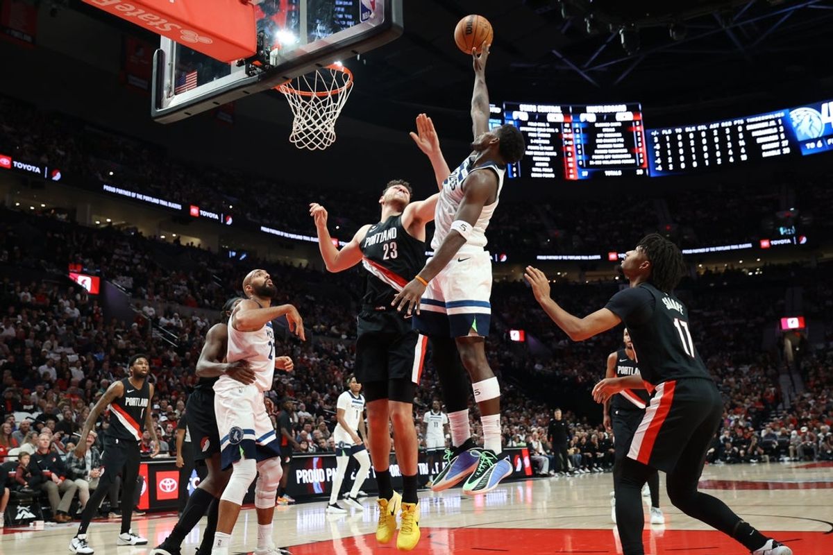 Oct 22, 2025; Portland, Oregon, USA;  Minnesota Timberwolves guard Anthony Edwards (5) shoots the ball over Portland Trail Blazers center Donovan Clingan (23) in the first half at Moda Center. Mandatory Credit: Jaime Valdez-Imagn Images
