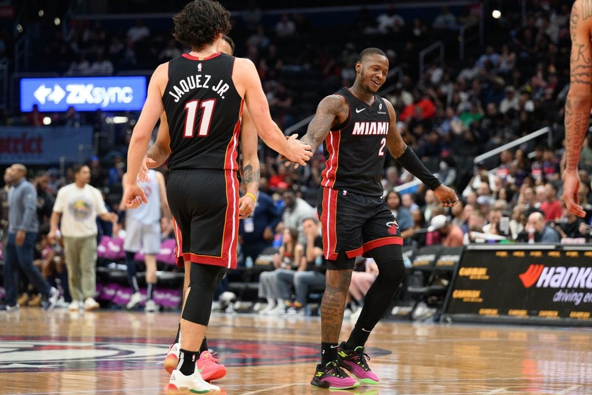Mar 31, 2025; Washington, District of Columbia, USA; Miami Heat guard Terry Rozier (2) and guard Jaime Jaquez Jr. (11) celebrates during the fourth quarter against the Washington Wizards at Capital One Arena. Mandatory Credit: Reggie Hildred-Imagn Images