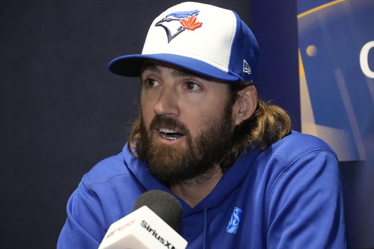 Oct 23, 2025; Toronto, ON, Canada; Toronto Blue Jays starting pitcher Kevin Gausman (34) answers questions during media day before game one of the World Series at Rogers Centre. Mandatory Credit: John E. Sokolowski-Imagn Images