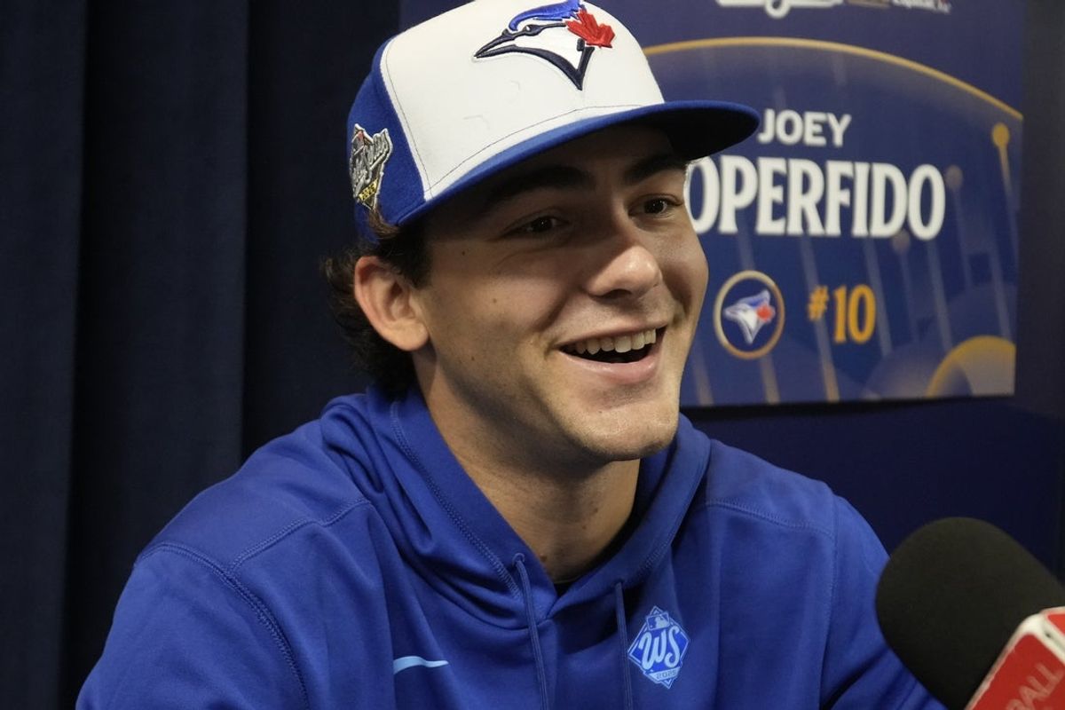 Oct 23, 2025; Toronto, ON, Canada;  Toronto Blue Jays outfielder Joey Loperfido (10) answers a question during media day before game one of the World Series at Rogers Centre. Mandatory Credit: John E. Sokolowski-Imagn Images