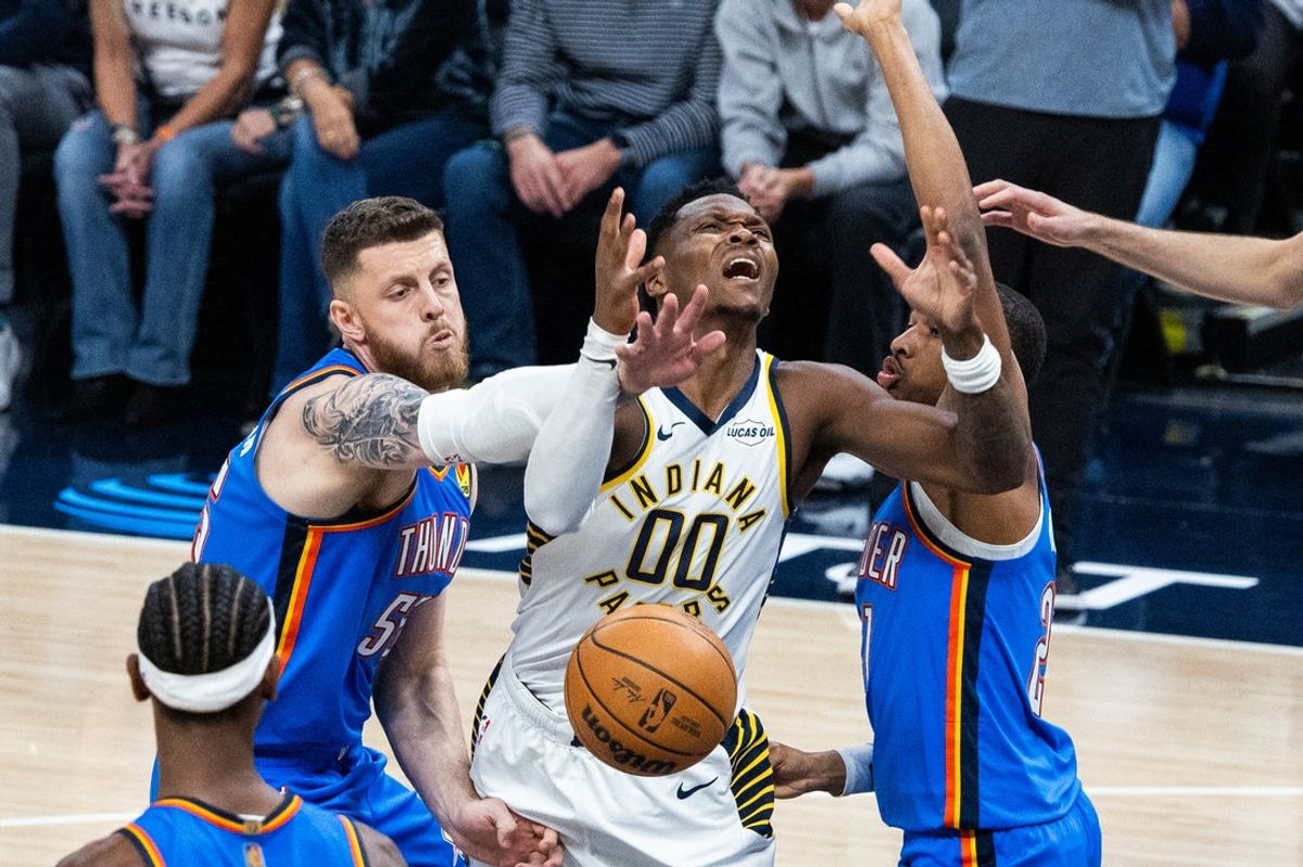 Oct 23, 2025; Indianapolis, Indiana, USA; Indiana Pacers guard Bennedict Mathurin (00) has his shoot attempt blocked by Oklahoma City Thunder center Isaiah Hartenstein (55) in the first half at Gainbridge Fieldhouse. Mandatory Credit: Trevor Ruszkowski-Imagn Images