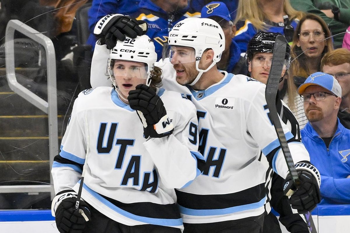 Oct 23, 2025; St. Louis, Missouri, USA; Utah Mammoth center Logan Cooley (92) is congratulated by defenseman Ian Cole (28) after scoring against the St. Louis Blues during the first period at Enterprise Center. Mandatory Credit: Jeff Curry-Imagn Images