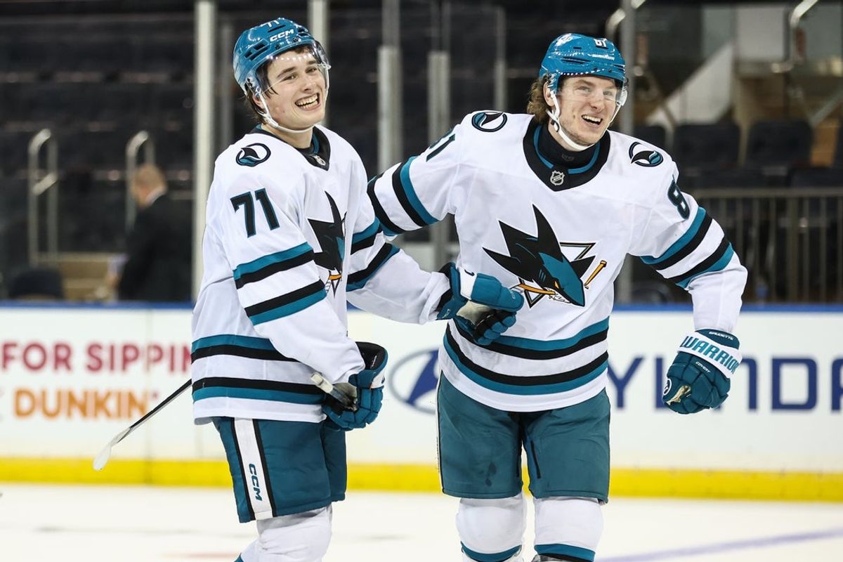Oct 23, 2025; New York, New York, USA;  San Jose Sharks center Macklin Celebrini (71) and right wing Adam Gaudette (81) celebrate after defeating the New York Rangers 6-5 in overtime at Madison Square Garden. Mandatory Credit: Wendell Cruz-Imagn Images