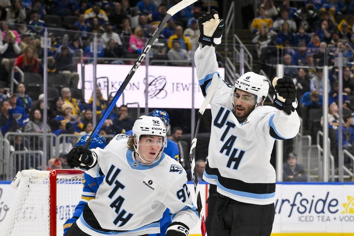 Oct 23, 2025; St. Louis, Missouri, USA; Utah Mammoth center Nick Schmaltz (8) celebrates with center Logan Cooley (92) after scoring against the St. Louis Blues during the third period at Enterprise Center. Mandatory Credit: Jeff Curry-Imagn Images