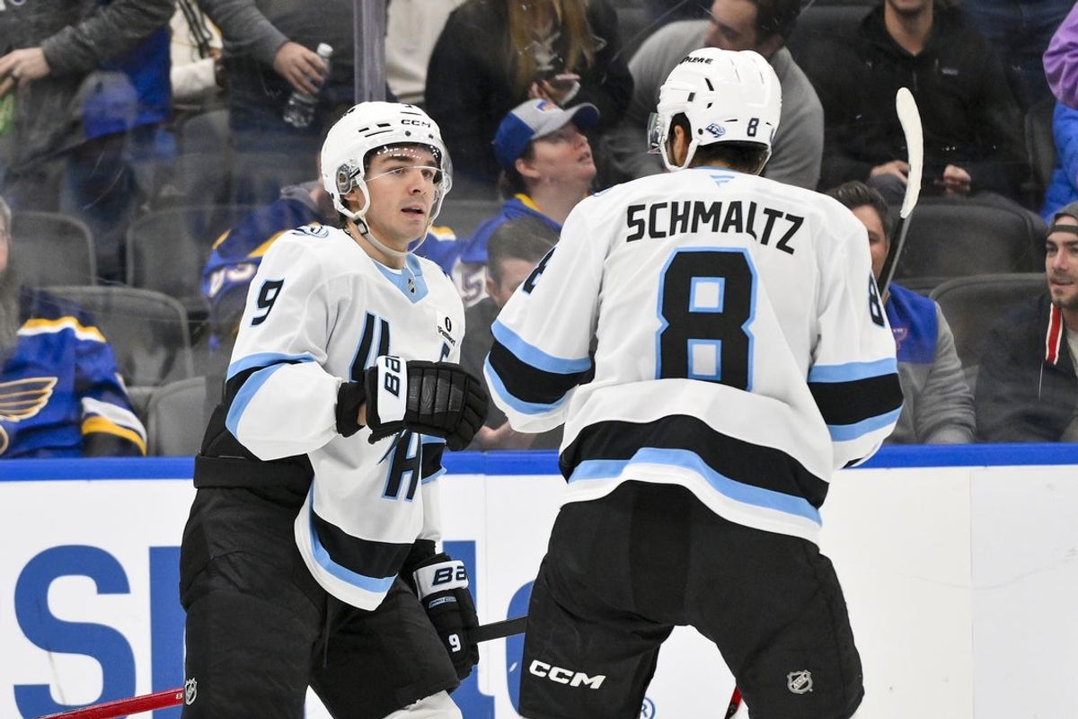 Oct 23, 2025; St. Louis, Missouri, USA; Utah Mammoth right wing Clayton Keller (9) celebrates with center Nick Schmaltz (8) after scoring an empty net goal against the St. Louis Blues during the third period at Enterprise Center. Mandatory Credit: Jeff Curry-Imagn Images