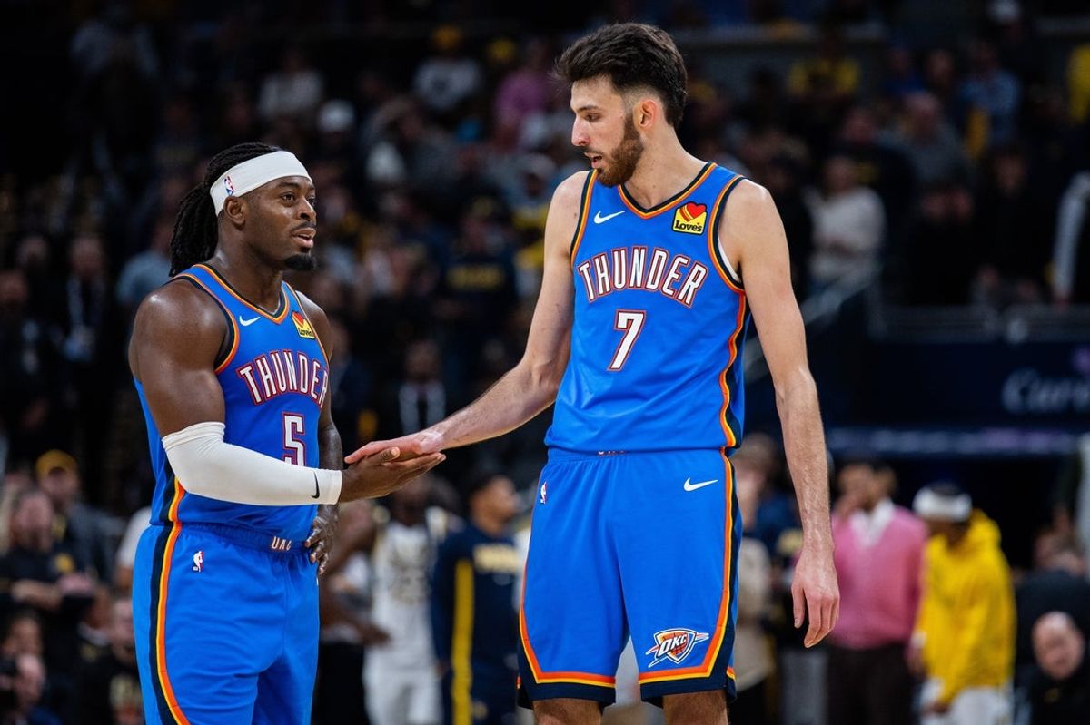 Oct 23, 2025; Indianapolis, Indiana, USA;  Oklahoma City Thunder guard Luguentz Dort (5) and center Chet Holmgren (7) in the second half against the Indiana Pacers at Gainbridge Fieldhouse. Mandatory Credit: Trevor Ruszkowski-Imagn Images